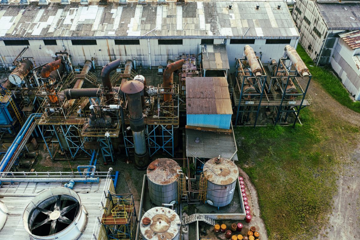 Industrial drums and pipework at a storage yard