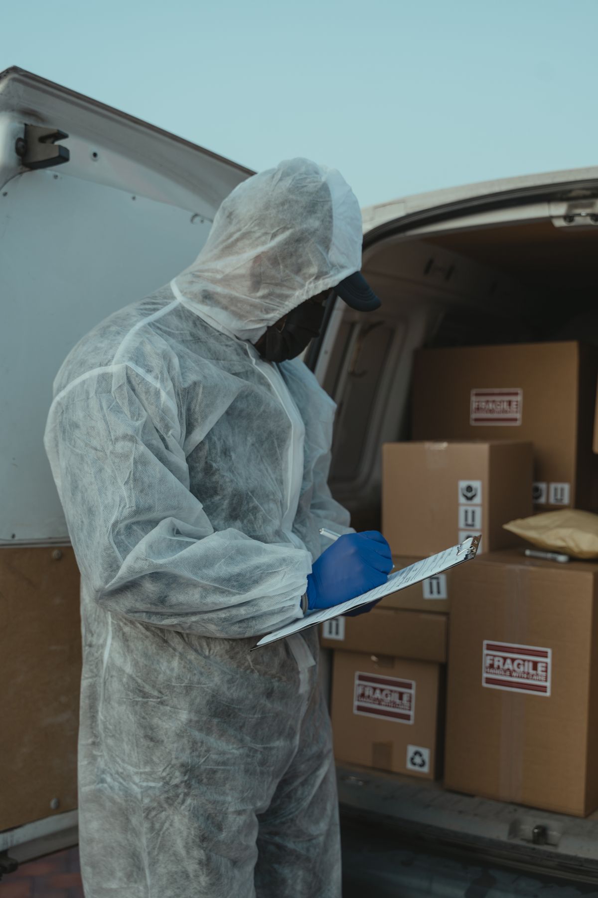 Logistics worker inspecting packaged goods