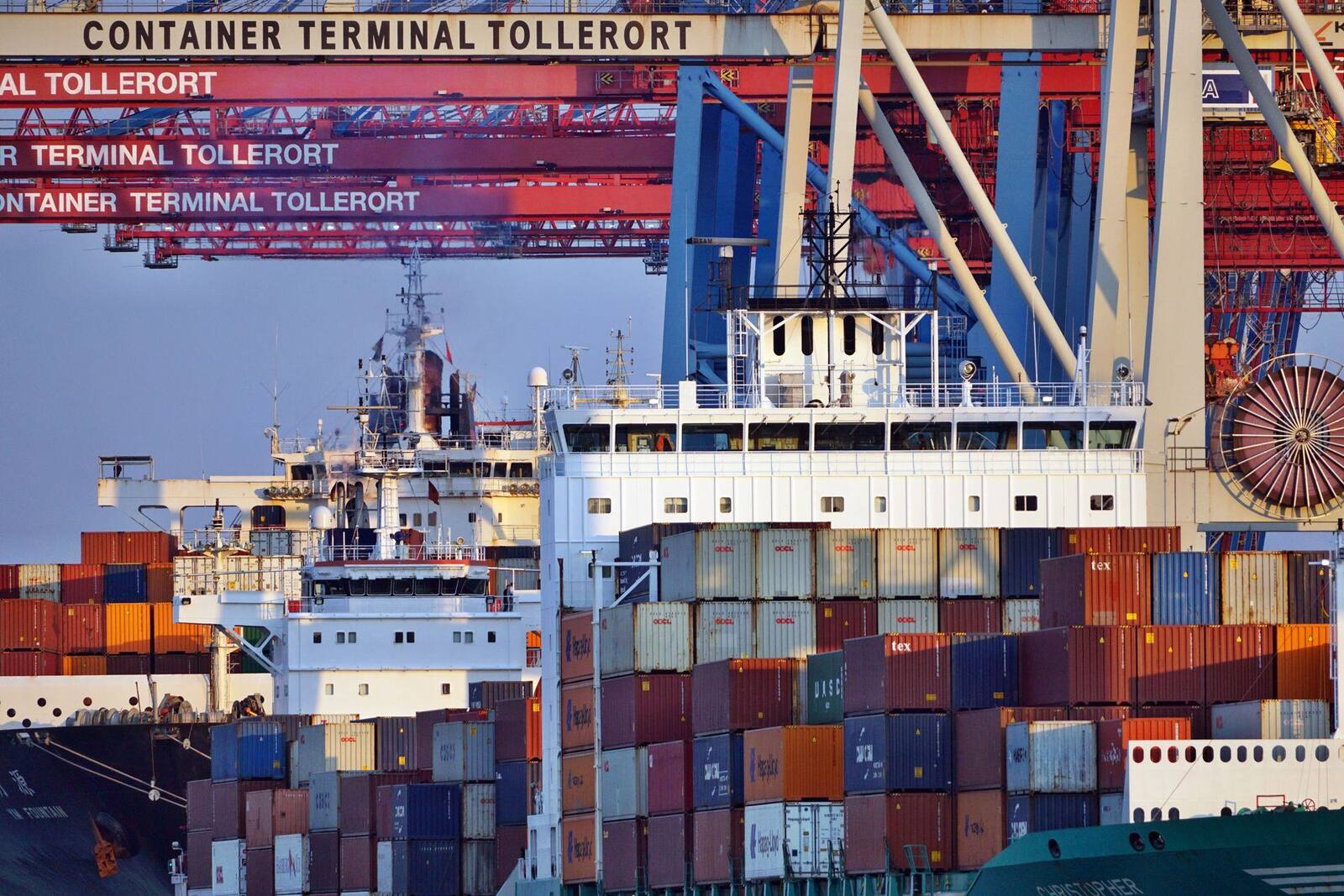 Container ships at a terminal at dusk