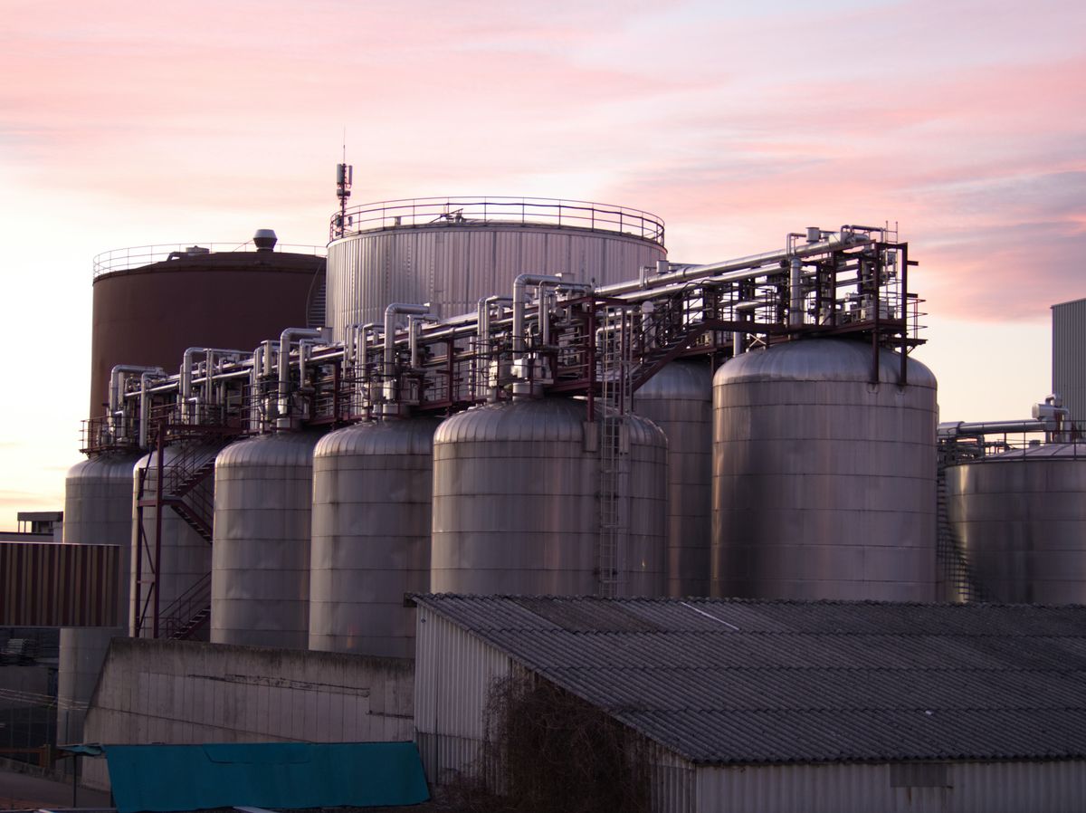 Storage tanks at an industrial terminal at sunset